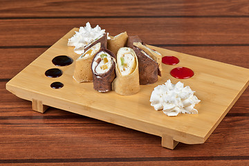 Image showing pancake roll with marmalade