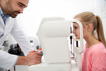 Image showing optician with tonometer and patient at eye clinic