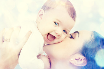 Image showing happy mother kissing baby