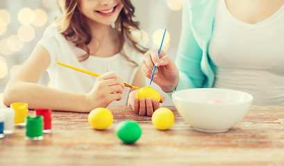 Image showing close up of family coloring easter eggs
