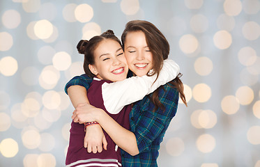 Image showing happy smiling pretty teenage girls hugging