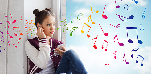 Image showing teenage girl with smartphone and earphones