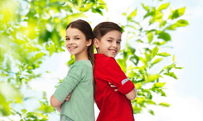 Image showing happy boy and girl standing together