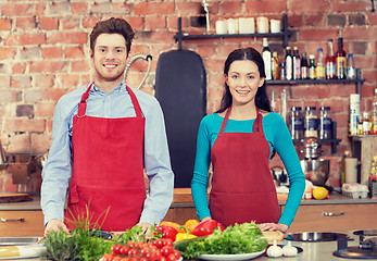 Image showing happy couple in kitchen at cooking class