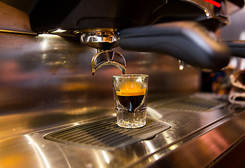 Image showing close up of espresso machine making coffee