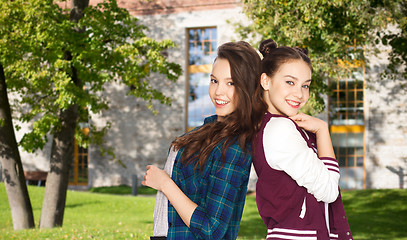 Image showing happy smiling pretty teenage girls over campus 