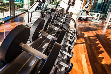 Image showing Dumbbells in the gym. Gym interior with equipment