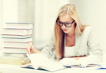 Image showing student with books and notes