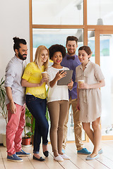 Image showing creative team with tablet pc and coffee at office