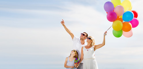 Image showing family with colorful balloons