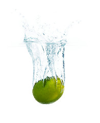 Image showing lime falling or dipping in water with splash