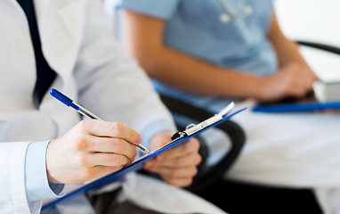 Image showing close up of happy doctors at seminar or hospital