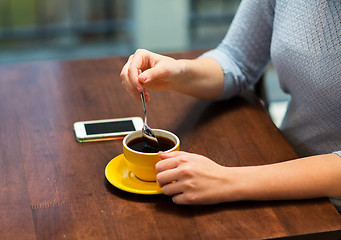 Image showing close up of woman with smartphone and coffee