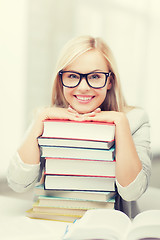 Image showing student with stack of books