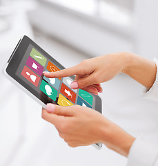 Image showing close up of hands with applications on tablet pc