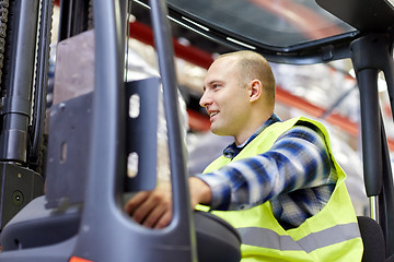 Image showing man operating forklift loader at warehouse