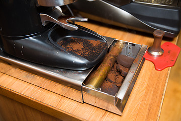 Image showing close up of coffee mill box with millcake at cafe