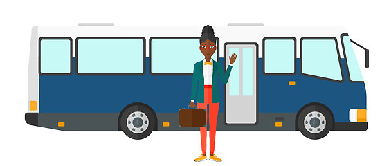 Image showing Woman standing near bus.