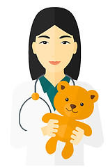 Image showing Pediatrician holding teddy bear.