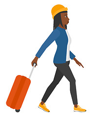 Image showing Woman walking with suitcase.