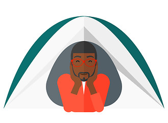 Image showing Man lying in tent.