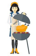 Image showing Woman preparing barbecue.