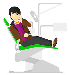 Image showing Man suffering in dental chair.