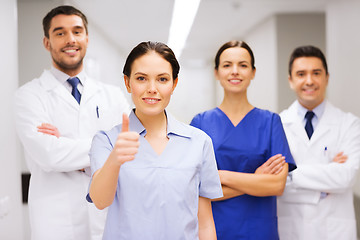 Image showing medics or doctors at hospital showing thumbs up