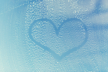 Image showing close up of heart shape on soapy window glass