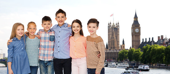 Image showing happy smiling children hugging over london