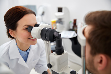 Image showing optician with tonometer and patient at eye clinic