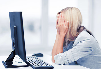 Image showing stressed woman with computer