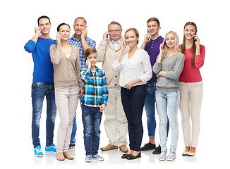 Image showing group of smiling people with smartphones