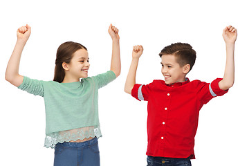 Image showing happy boy and girl celebrating victory