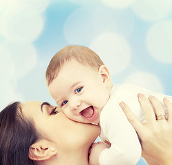 Image showing laughing baby playing with mother