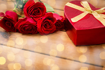 Image showing close up of heart shaped gift box and red roses