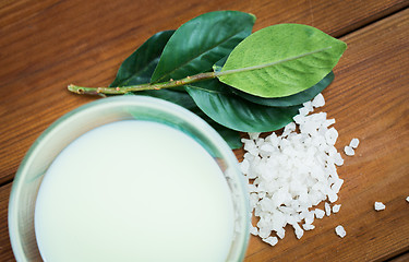 Image showing close up of citrus body lotion in bowl on wood