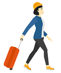 Image showing Woman walking with suitcase.