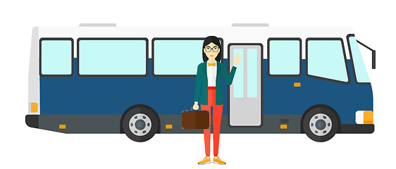 Image showing Woman standing near bus.