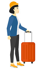 Image showing Woman standing with suitcase.