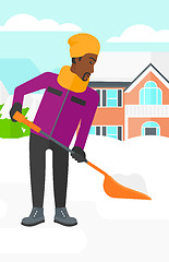 Image showing Man shoveling and removing snow.