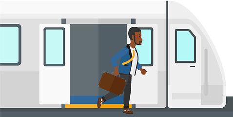 Image showing Man going out of train.