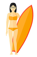 Image showing Surfer holding surfboard.