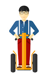 Image showing Man riding on electric scooter.