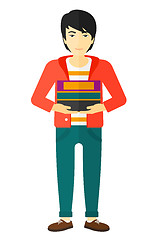 Image showing Man holding pile of books.