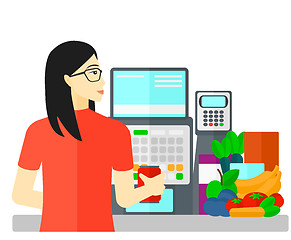 Image showing Cashier at supermarket checkout.