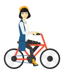 Image showing Woman riding bicycle.