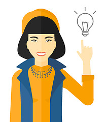 Image showing Woman pointing at light bulb.