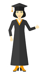 Image showing Graduate showing thumb up sign.