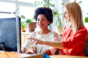 Image showing happy women or students with computer in office